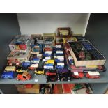 A shelf of mixed vintage diecasts including Dinky Military, Matchbox and Models of Yesteryear,