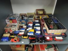 A shelf of mixed vintage diecasts including Dinky Military, Matchbox and Models of Yesteryear,