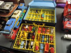 A 1980's Matchbox carry case having four plastic container holding 26 Matchbox Lesney, Husky and
