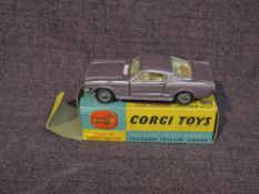 A Corgi diecast, 320 Ford Mustang Fastback 2+2 in metallic lilac with white interior, in original