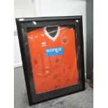 A Blackpool FC 2013-2015 Replica Home Shirt, bearing 18 signatures from the players, framed and