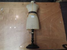 A Stockman Paris Child's Mannequin on wooden adjustable stand, height approx 75cm