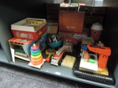 A shelf of 1970's Fisher Price and similar plastic Toys including Camper, Farm, Record Player,