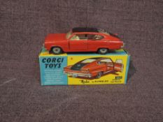 A Corgi diecast, 263 Marlin by Rambler Sports Fastback in red with black roof and white interior, in
