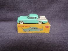 A Dinky diecast, 169 Studebaker Golden Hawk, Green & Cream in original correct spot box, missing one