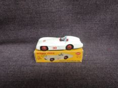 A Dinky diecast, 237 Mercedes Benz Racer, White with Red Hubs in original box