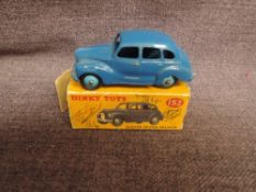 A Dinky diecast, 152 Austin Devon, Dark Blue with light blue hubs in original box, missing flaps