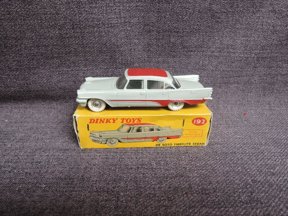 A Dinky diecast, 192 De Soto Fireflite Sedan, Grey & Red in original correct spot box