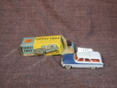 A Corgi diecast, 424 Ford Zephyr Estate Car in two tone blue with red interior, in original box