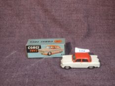 A Corgi diecast, 207 Standard Vanguard III Saloon in pale green with red roof and pillars, in
