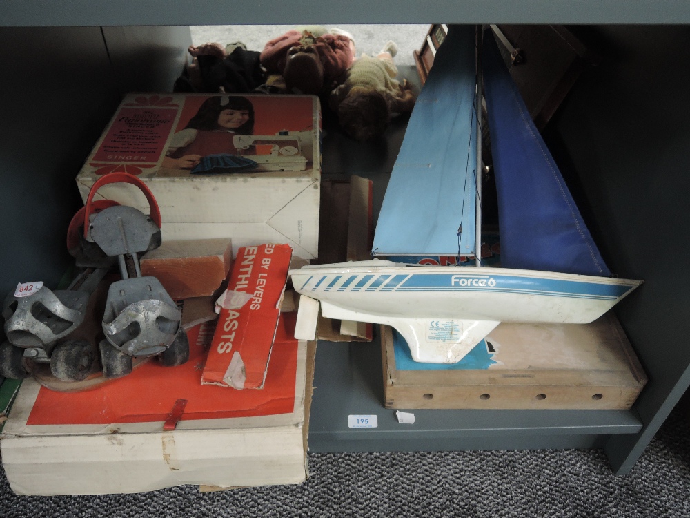 A shelf of vintage Toys and Games including Chad Valley tin plate Soccer, boxed, Singer Little