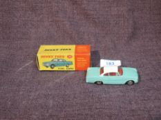 A Dinky diecast, 143 Ford Capri in turquoise with white roof and red interior, in original box