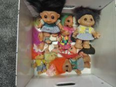 Twelve 1980's Dams Troll Dolls, various sizes and all clothed