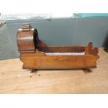 A traditional mahogany Doll's Crib on rocking base, length 56cm, height 36cm