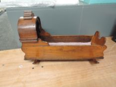 A traditional mahogany Doll's Crib on rocking base, length 56cm, height 36cm