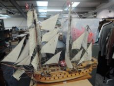 A hand built wooden scale model of Danish Sailing Ship having extensive rigging and cannon