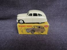 A Dinky diecast, 153 Standard Vanguard, Cream, in original correct spot box