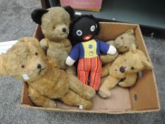 Four mid 20th century straw filled yellow plush Teddy Bears all having plastic eyes, stitched