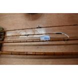 A 3 piece split cane fly rod by Edminson Alnwick with spare tip in canvas sleeve