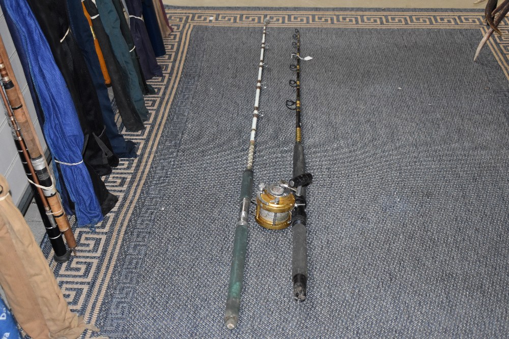 Two mitchell boat sea fishing rods one with a penn international 20 big game saltwater lever drag