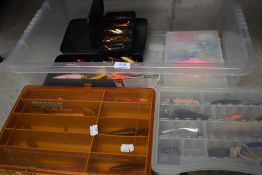 A large selection of fishing lures and spinners in boxes