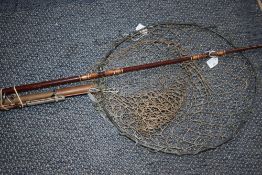 A shakespeare boat rod , an Abu fly rod and a intage wooden handled landing net