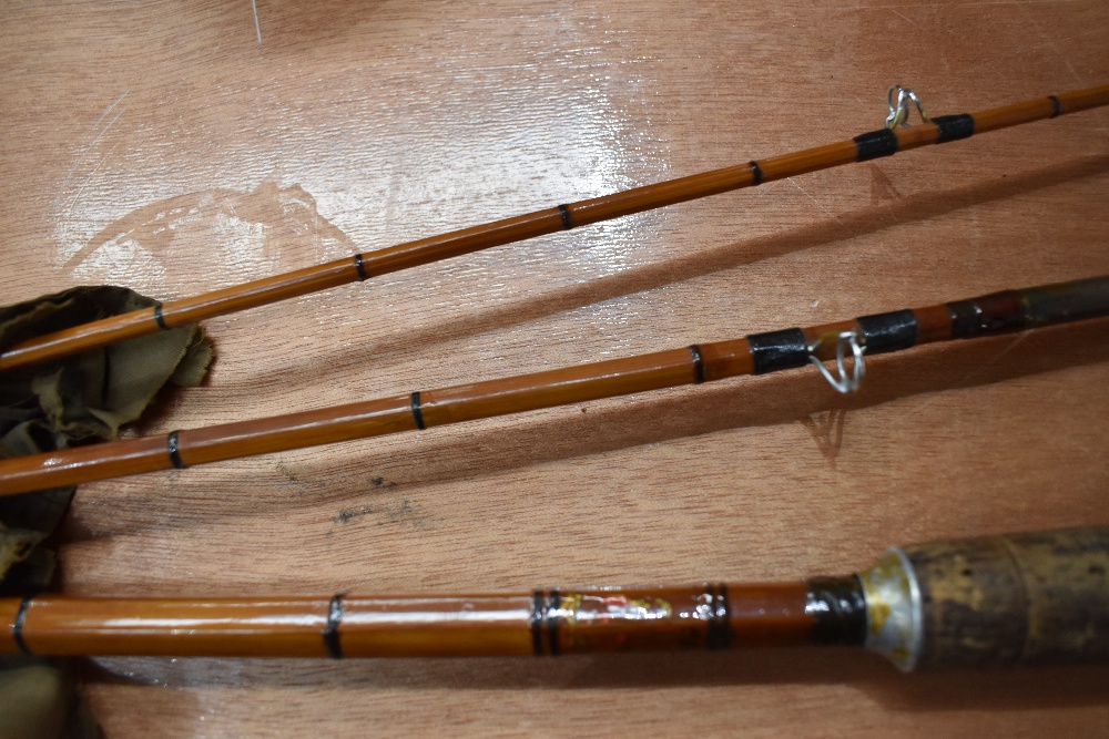 A 3 pc cane rod marked but unreadable