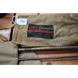 An Edgar Sealy 2pc Octopus split cane fly rod and another 2pc carbon fly rod both in soft sleeves