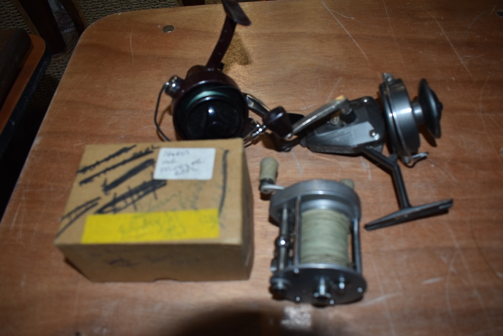 A Pluger Supreme reel with a box marked spares for pluger reel. a vintage shakespeare standard