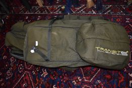 An Avid Carp Rod and tackle Tansit S+ padded transport system with a Grand Slam bag