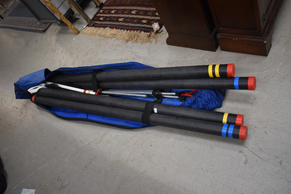A Matchman 4 rod carry case containing a selection of telescopic rod rests and a landing net along
