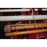 A vintage fiberglass beachcaster rod and a Steade fast spinning rod