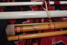 A vintage fiberglass beachcaster rod and a Steade fast spinning rod