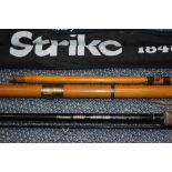 A Daiwa sensor carbon spin 3.05m, A Shakespeare strike 3.90m and a wooden boat rod