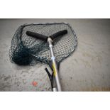 A Shakespeare telescopic landing net and rod rests