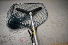 A Shakespeare telescopic landing net and rod rests