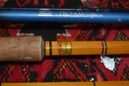 An Allcocks Climax vintage cane rod and a Shakespeare Pro am spin Rod