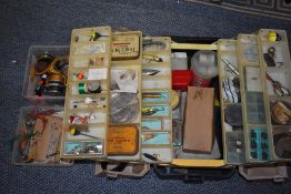 A Large selection of fishing tackle including Lures,hooks flies, weights and a reel