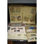 A selection of early 20th century cigarette card albums including Railway, Transport and Flowers