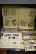 A selection of early 20th century cigarette card albums including Railway, Transport and Flowers