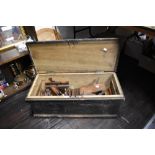 A joiners stained pine tool box, containing numerous moulding planes, mostly bearing name stamp