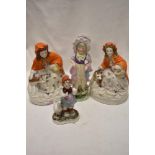 Three antique bisque figures including two red riding hood, girl in bonnet and German figure with