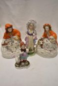 Three antique bisque figures including two red riding hood, girl in bonnet and German figure with