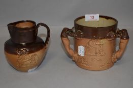 Two antique pieces of Royal Doulton both in salt glazes, a small milk jug and a Fox Hunting or
