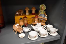 A dolls tea set and a selection of wooden toys and animals