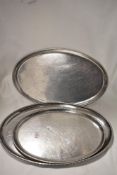 Three vintage stainless steel platters.