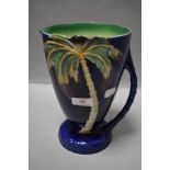 A Beswick 1028 vintage pitcher or water jug with Palm tree and deep blue glaze design 23cm tall