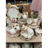 A selection of mixed antique ceramics, amongst which are cups and saucers and plates to include