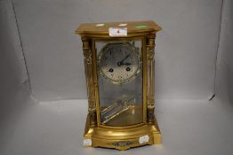 A late 20th century French mantel clock having ormolu case with Champleve enamel worked