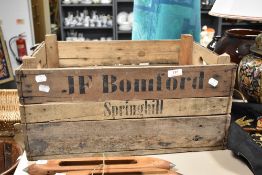 A vintage wooden advertising crate, name JF Bomford-Springhill